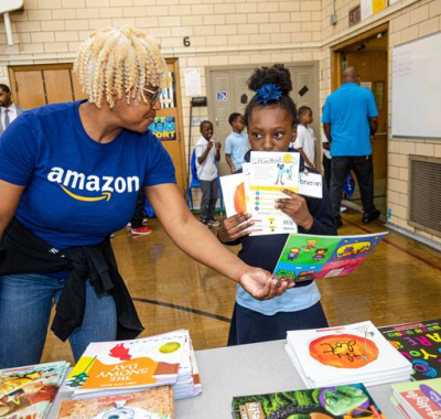 Amazon employee volunteer book distribution event partner