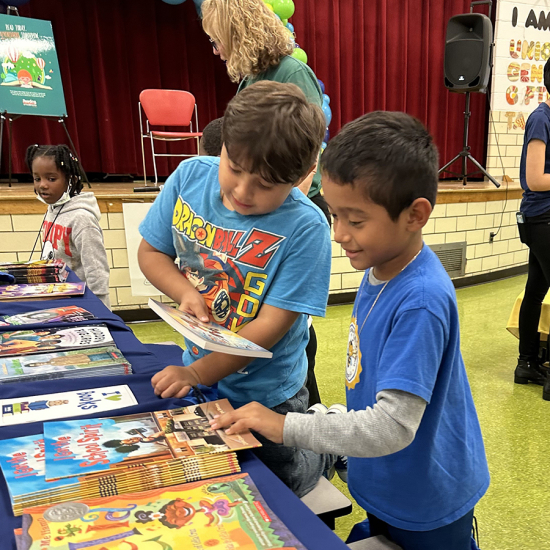 two boys looking at books