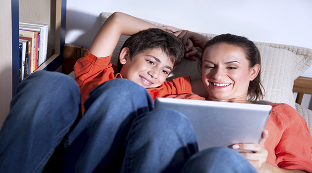 Mother and son reading together