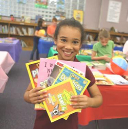 Image of a girl holding books