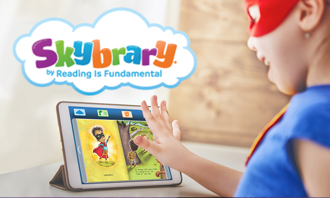 super hero kid reading super hero book on tablet