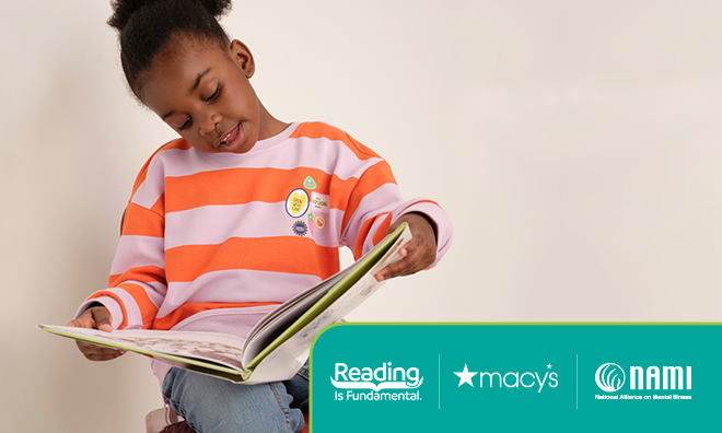 child happily reading a book