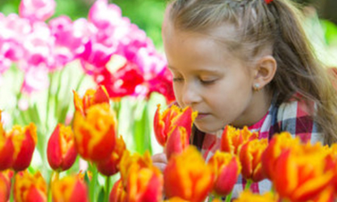 girl smelling flowers