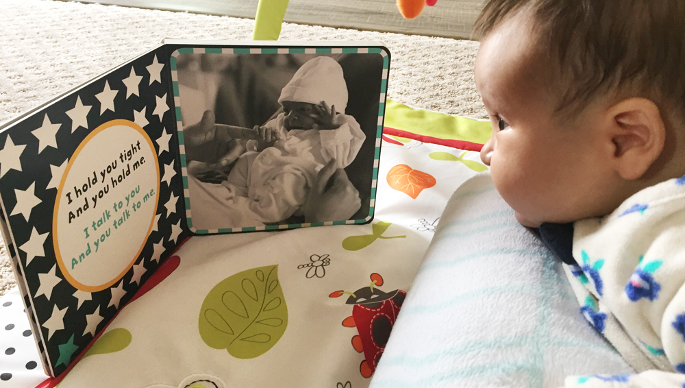 Baby looking at a book