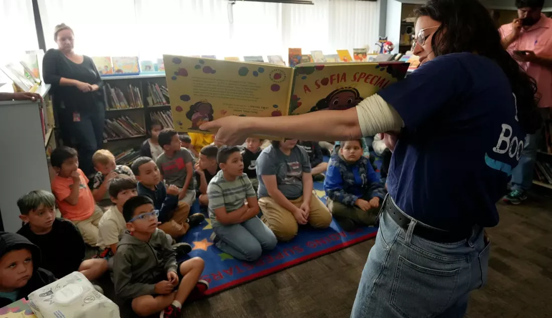 Kids engaged in a book event