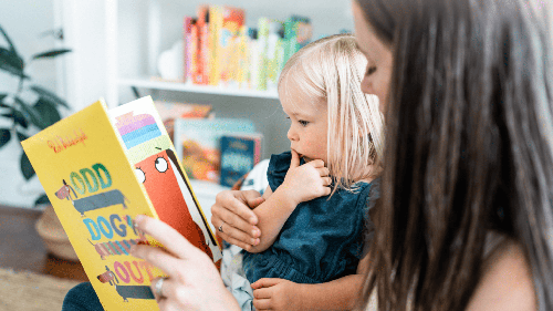 child with mother reading together