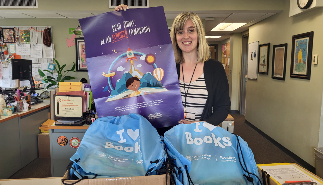 Employee opening literacy kit box