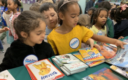 RIF Theory of Change Models - girls at book selection