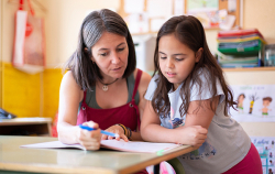 Adult and child reading together
