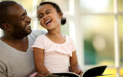 Father and daughter reading a book
