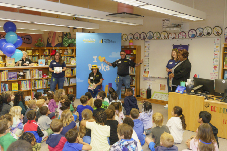 RIF kids gathered around for an I heart books event
