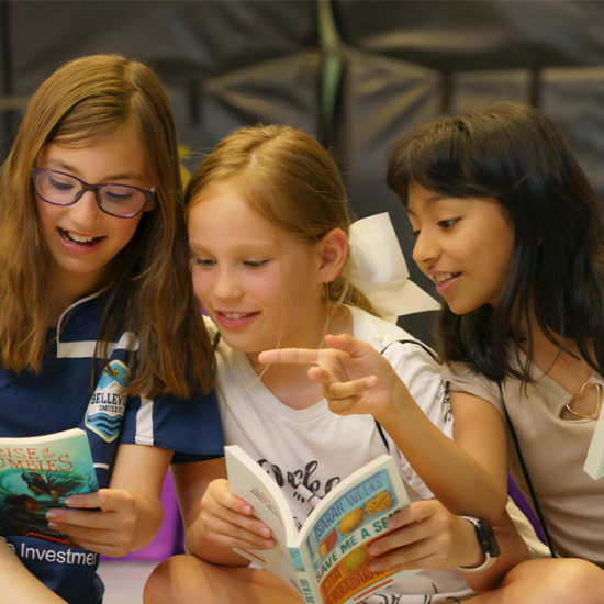 Girls reading books together