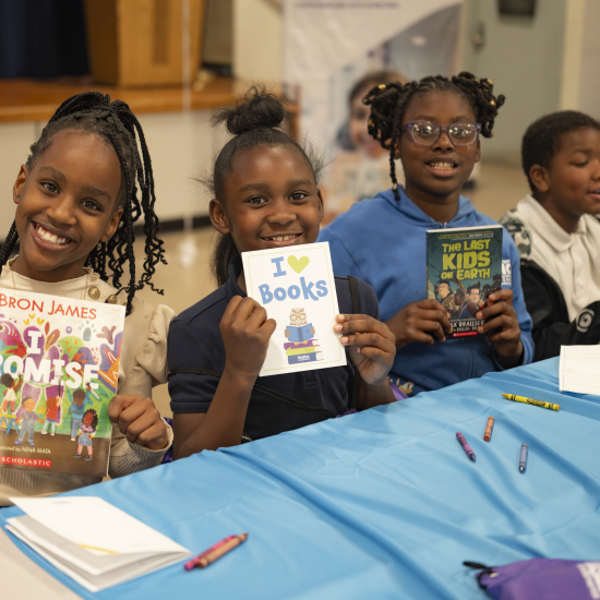 girls smiling with books