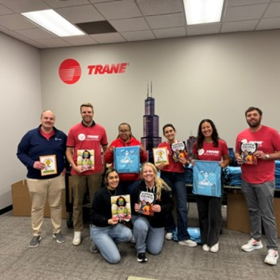 Trane employees participating in a literacy kit kitting event