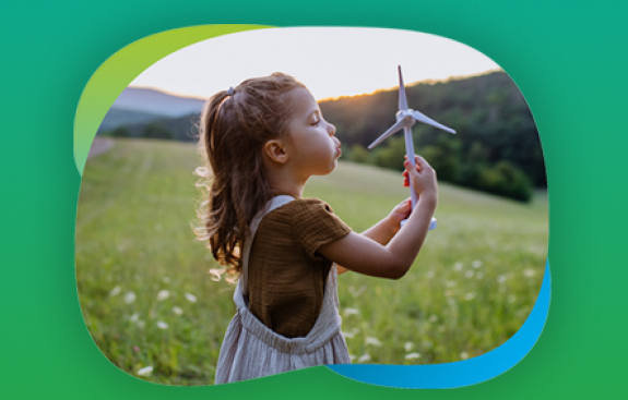 girl spinning a mini wind turnbine