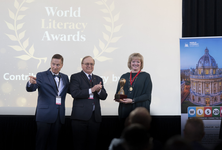 Alicia accepting the award from World Literacy Foundation