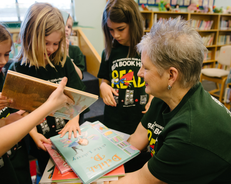 RIF volunteer book distribution event with children