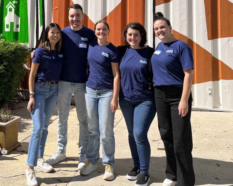 RIF Staff with mural at Amazon in Baltimore