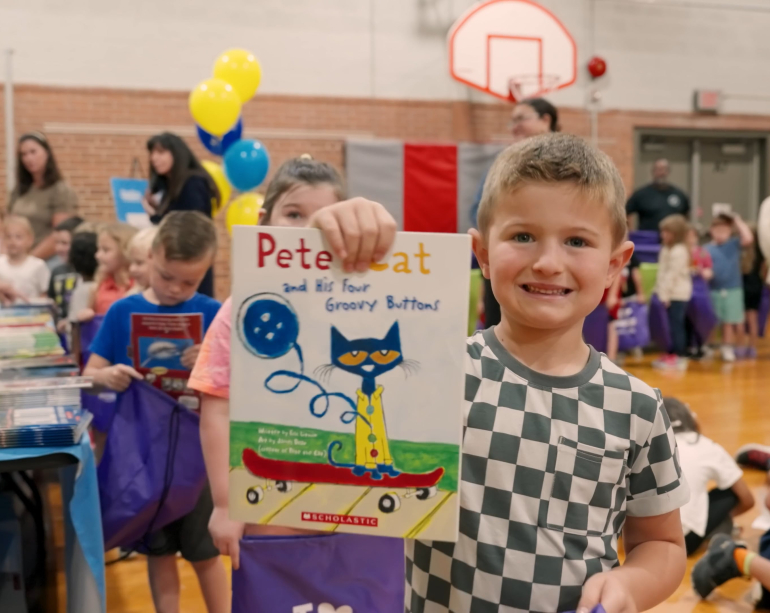 Happy boy with book
