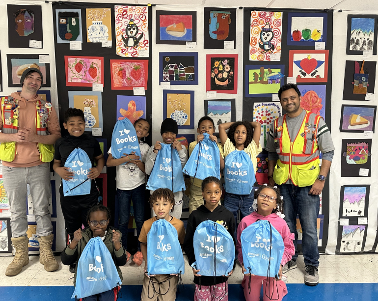 children holding up literacy kits