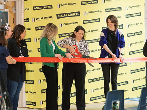 RIF and Dollar General cut the ribbon to open the new school library.
