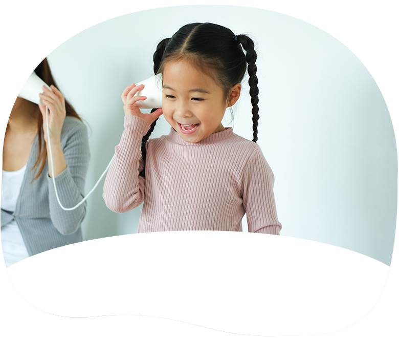 little girl with string cup phone