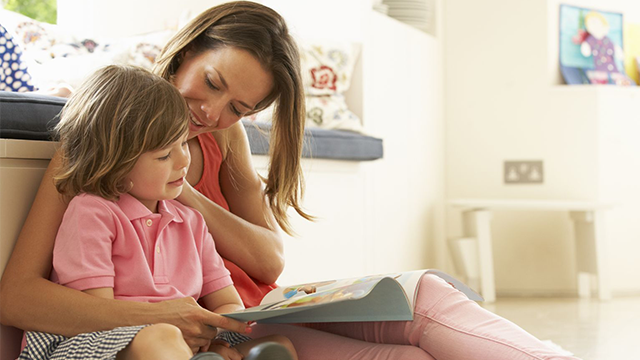 A mother reads to her child