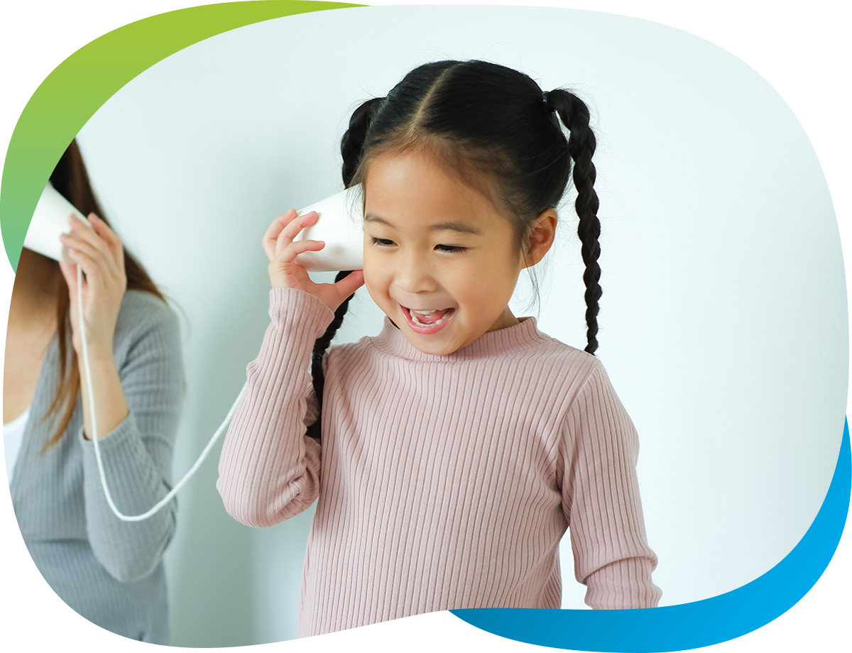 little girl with string cup phone