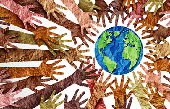 Kids hands reaching for the earth