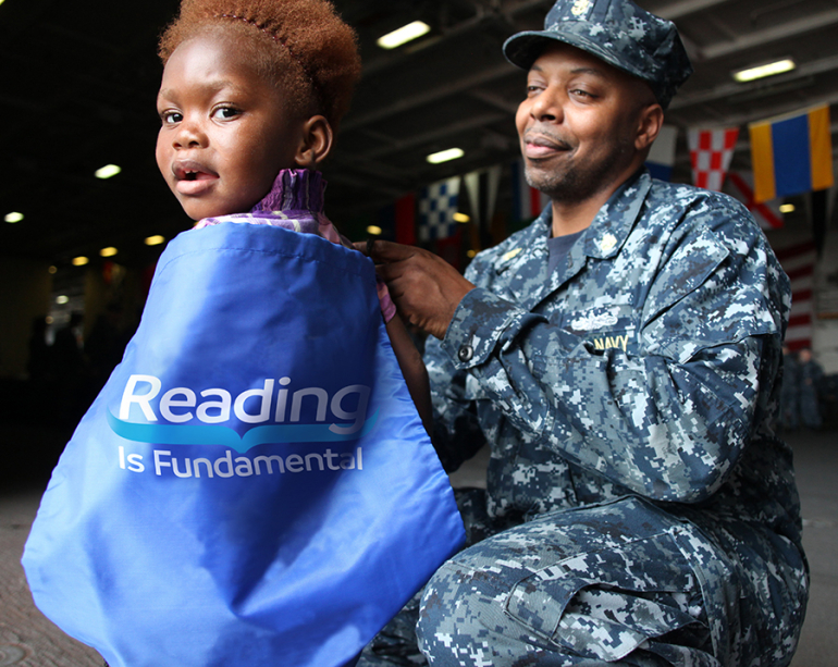 Girl with tote and military dad