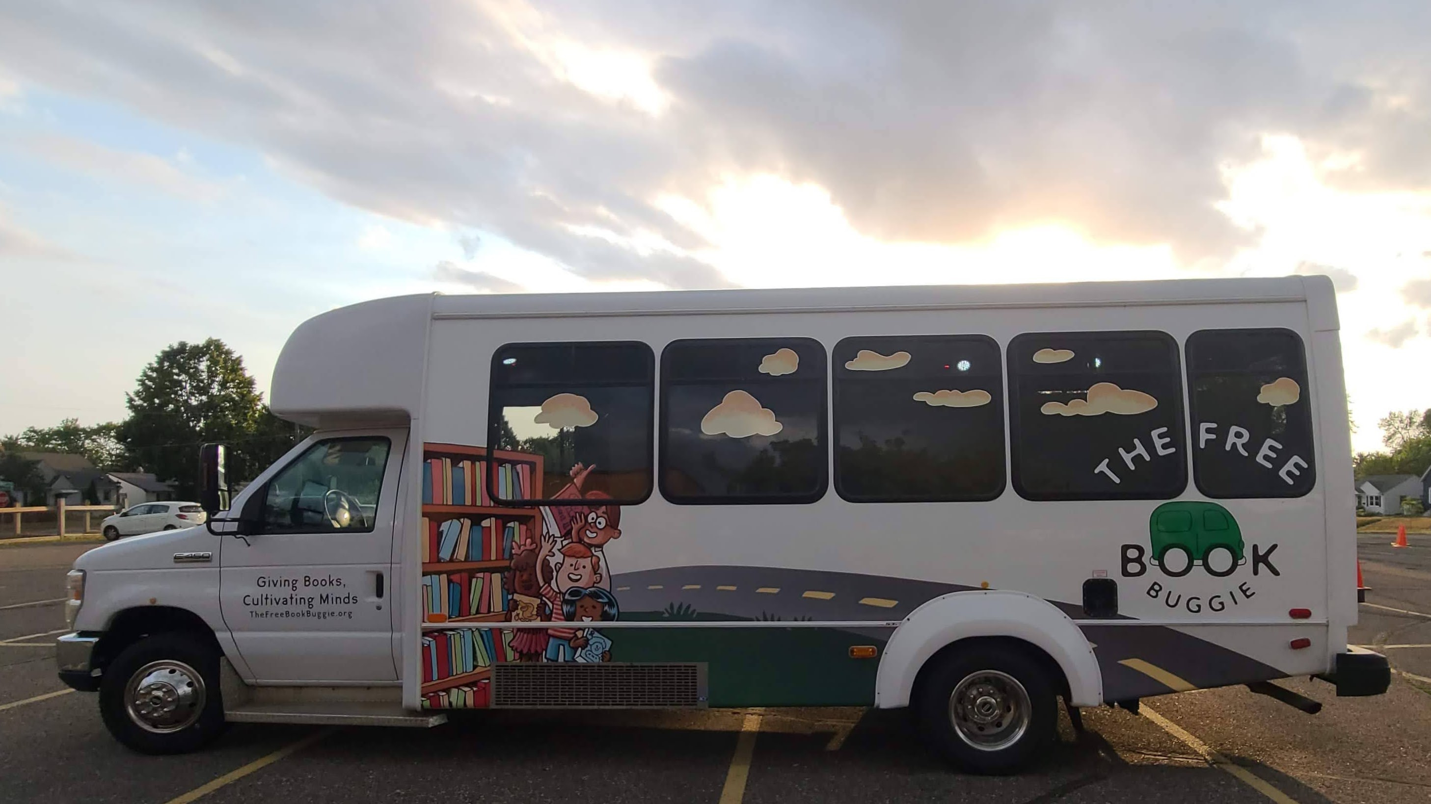 The Free Book Buggie, a bus with a design of a bookshelf along a road
